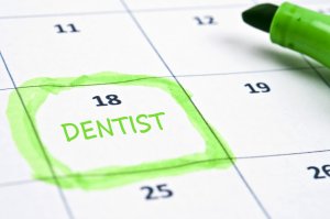 Calendar with the word 'Dentist' written on the 18th